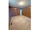 Spacious bedroom with wood paneled walls and carpeted flooring at 3412 1St Avenue Nw Cir, Hickory, NC 28601