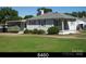 Single-story home with light siding, an open yard, and an attached covered parking area at 3412 1St Avenue Nw Cir, Hickory, NC 28601