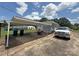 Exterior view of a home with a carport and parked vehicle at 3412 1St Avenue Nw Cir, Hickory, NC 28601
