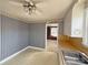 Cozy eat-in kitchen with striped wallpaper, light-colored cabinets, wood countertops, and vinyl flooring at 3412 1St Avenue Nw Cir, Hickory, NC 28601