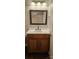 Bathroom featuring a vanity with a dark framed mirror and a white countertop at 3549 Calpella Ct, Charlotte, NC 28262