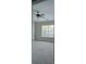 Bright bedroom featuring neutral walls, a ceiling fan, and large windows overlooking the neighborhood at 3549 Calpella Ct, Charlotte, NC 28262