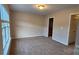 Neutral bedroom with a large window and neutral walls at 3549 Calpella Ct, Charlotte, NC 28262