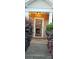 Inviting entrance featuring a glass storm door and manicured shrubbery at 3549 Calpella Ct, Charlotte, NC 28262