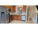 Stylish kitchen featuring stainless steel appliances, granite countertops, and a view of the dining area at 3549 Calpella Ct, Charlotte, NC 28262