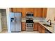 Modern kitchen with stainless steel appliances, granite countertops, and ample cabinet space at 3549 Calpella Ct, Charlotte, NC 28262
