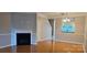 Spacious living area with a fireplace and a view into the dining area at 3549 Calpella Ct, Charlotte, NC 28262