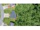 A bird's-eye view of a house with a newly installed roof and lots of trees at 431 Forest Dr, Maiden, NC 28650