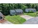 Aerial view of the residence showing driveway and spacious lawn with mature trees at 431 Forest Dr, Maiden, NC 28650