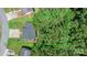 Aerial view of the property, highlighting the home's position on the lot with surrounding trees and greenery at 431 Forest Dr, Maiden, NC 28650