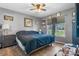 Bedroom with hardwood floor, ceiling fan, window and bed with blue covers at 431 Forest Dr, Maiden, NC 28650