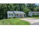 Charming single-story home with a covered porch and well-maintained front yard at 431 Forest Dr, Maiden, NC 28650