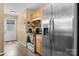 The kitchen has a stainless steel refrigerator and wood cabinets, along with a door to the outside at 431 Forest Dr, Maiden, NC 28650