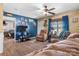 Spacious living room with hardwood flooring, ceiling fan, and comfortable seating with a TV at 431 Forest Dr, Maiden, NC 28650