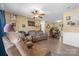 Cozy living room featuring comfortable furniture, a ceiling fan, neutral walls, and dining area beyond at 431 Forest Dr, Maiden, NC 28650