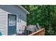 View of the wood deck, accessible from the home's rear, featuring a grill, a chair, and an exterior door at 431 Forest Dr, Maiden, NC 28650