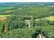 Expansive estate surrounded by dense woods offers privacy and seclusion at 440 Bridlewood Dr, Gold Hill, NC 28071