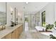 Stunning bathroom with marble floors, dual vanities, a soaking tub, and a glass-enclosed shower at 440 Bridlewood Dr, Gold Hill, NC 28071