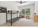 Bright bedroom with a bunk bed, neutral walls, black window frames, and neutral carpet flooring at 440 Bridlewood Dr, Gold Hill, NC 28071
