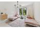 Bright ' bedroom with two single beds, neutral walls, black window frames, and patterned rug at 440 Bridlewood Dr, Gold Hill, NC 28071