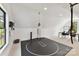Spacious bonus room with a wrestling mat, a punching bag, a black desk, and great natural light at 440 Bridlewood Dr, Gold Hill, NC 28071