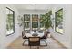 Bright dining room featuring stylish decor, modern lighting, and natural light through large windows at 440 Bridlewood Dr, Gold Hill, NC 28071
