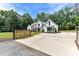 Beautiful exterior featuring a gated entrance and well-manicured lawn at 440 Bridlewood Dr, Gold Hill, NC 28071