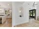Hallway showcasing modern archway and a glimpse into the kitchen and dining areas at 440 Bridlewood Dr, Gold Hill, NC 28071