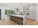 Gourmet kitchen with a large island, pendant lighting, stainless steel appliances, and hardwood floors at 440 Bridlewood Dr, Gold Hill, NC 28071