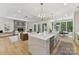 Modern living room features a gourmet kitchen, fireplace, leather couch, modern finishes, and lots of space at 440 Bridlewood Dr, Gold Hill, NC 28071