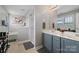 A bright bathroom with a double vanity, glass shower, and separate tub at 4408 Overbecks Ln, Waxhaw, NC 28173