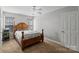 Cozy bedroom featuring a four-poster bed and neutral decor at 4408 Overbecks Ln, Waxhaw, NC 28173