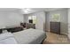 Comfortable bedroom with two beds, natural light, and neutral color scheme at 4408 Overbecks Ln, Waxhaw, NC 28173