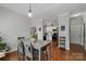 A view of the dining area and kitchen in an open floor plan at 4408 Overbecks Ln, Waxhaw, NC 28173
