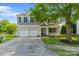 Charming two-story home featuring a well-manicured lawn, two-car garage, and inviting front porch at 4408 Overbecks Ln, Waxhaw, NC 28173