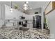 Beautiful kitchen featuring granite countertops, white cabinets, and stainless steel appliances at 4408 Overbecks Ln, Waxhaw, NC 28173