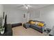 This living room features neutral walls, a gray sofa, and comfortable seating at 4408 Overbecks Ln, Waxhaw, NC 28173