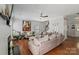 Comfortable living room with plush seating, fireplace, stairs and decor at 4408 Overbecks Ln, Waxhaw, NC 28173