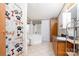 Bright bathroom featuring a tub, wooden cabinets, and a granite countertop at 495 Brumley Rd, Mooresville, NC 28115
