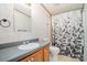Bathroom featuring a vanity, shower, and patterned wallpaper at 495 Brumley Rd, Mooresville, NC 28115