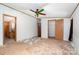 Bedroom with carpeted floors and multiple closets and doorways at 495 Brumley Rd, Mooresville, NC 28115