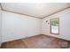 Cozy bedroom with neutral carpet, window, and natural lighting at 495 Brumley Rd, Mooresville, NC 28115