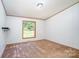 Cozy bedroom with neutral carpet, window, and natural lighting at 495 Brumley Rd, Mooresville, NC 28115