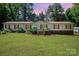Charming single-story home with a well-manicured lawn and inviting front porch at 495 Brumley Rd, Mooresville, NC 28115