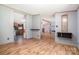 Bright living room featuring wood floors and open to other living areas at 495 Brumley Rd, Mooresville, NC 28115
