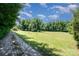 Wide shot of the property featuring a long driveway and expansive yard at 495 Brumley Rd, Mooresville, NC 28115