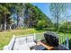 Cozy backyard deck with comfortable seating and a grill, perfect for summer barbecues at 50 Serenity Ln, Hickory, NC 28601