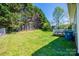 Expansive backyard featuring lush green grass and a private deck area, great for outdoor enjoyment at 50 Serenity Ln, Hickory, NC 28601