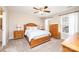 Spacious bedroom with carpet, ceiling fan, and a wooden bed with matching dressers on each side at 50 Serenity Ln, Hickory, NC 28601