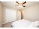 Bright bedroom with a ceiling fan, carpet, a closet, ensuite bathroom, and minimalist decor at 50 Serenity Ln, Hickory, NC 28601